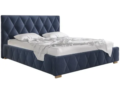 Łóżko tapicerowane TRIVIO Comforteo z ukośnymi przeszyciami w zagłówku